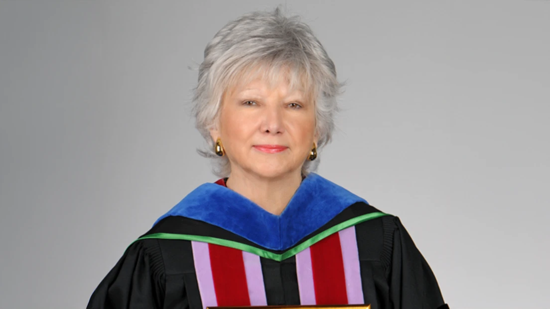 Headshot photo of Dr. Patricia Blanton in dental graduation regalia.