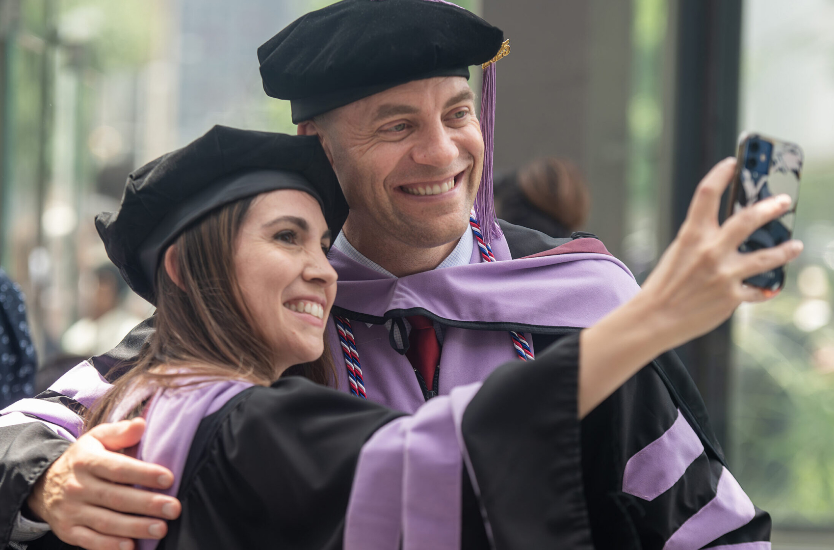 Faculty member and dental student at graduation.