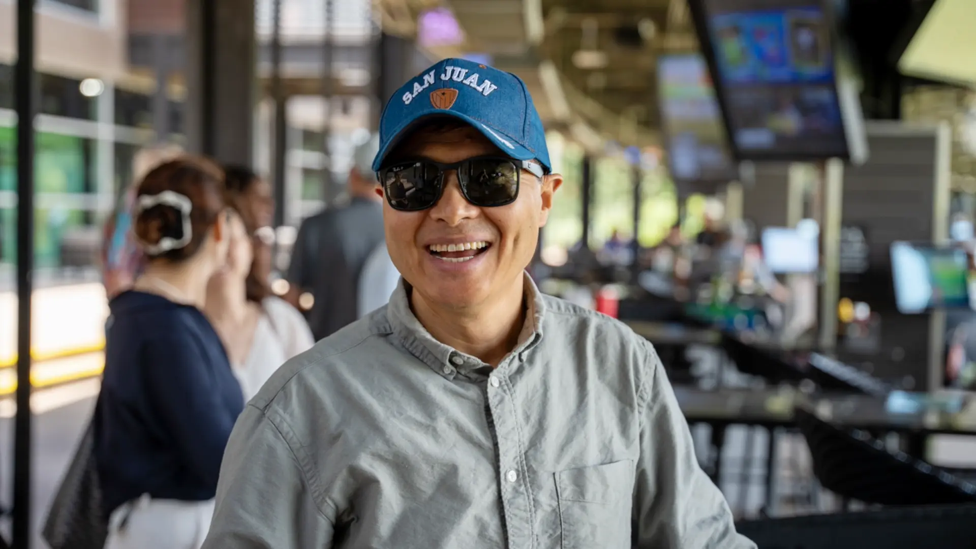 Man in a ball cap at departmental golfing event.