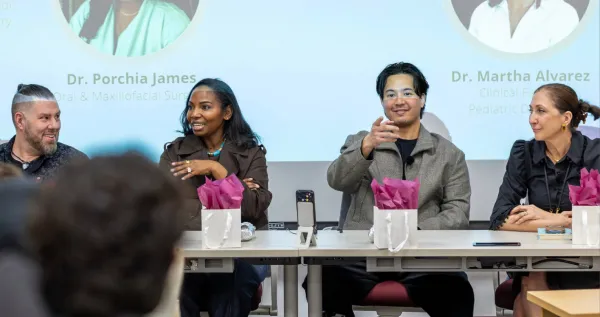 A panel of dental professionals speaks to an audience during a SPEP Collegiate program event.